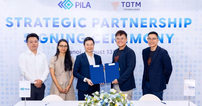PILA (Viet Nam) signs a strategic cooperation agreement with TOTM Technologies (Singapore). (Photo: NGOC ANH)