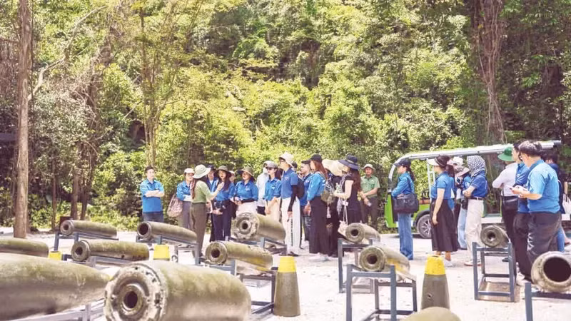 Visitors explore the outdoor exhibition of unexploded ordnance remnants at the Command Bunker.