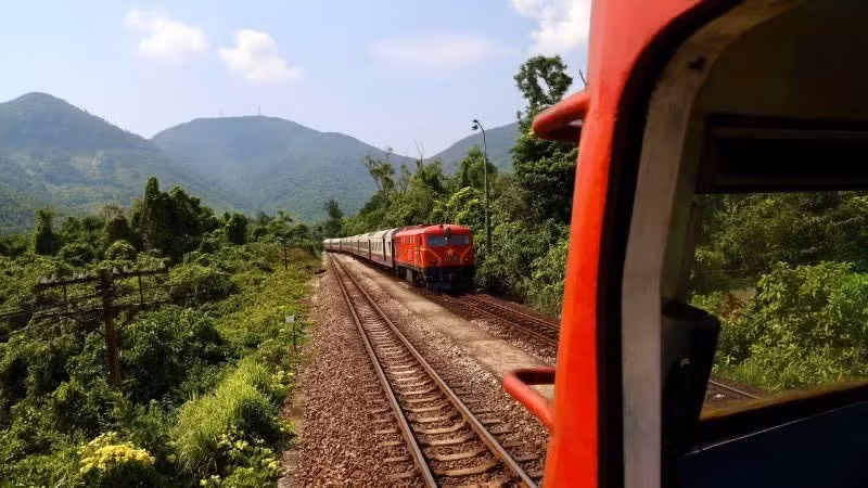 Trains pass through the sunlit and windy central region.