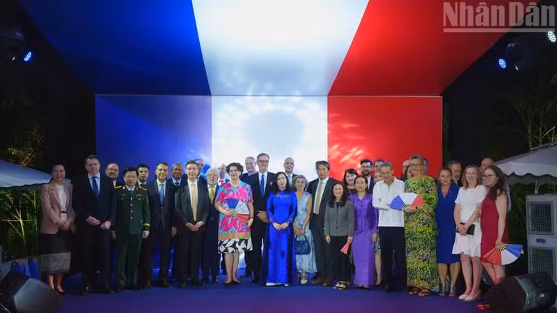 Diplomats and representatives of agencies and organisations pose for a group photo at the reception marking the 237th anniversary of the French National Day.