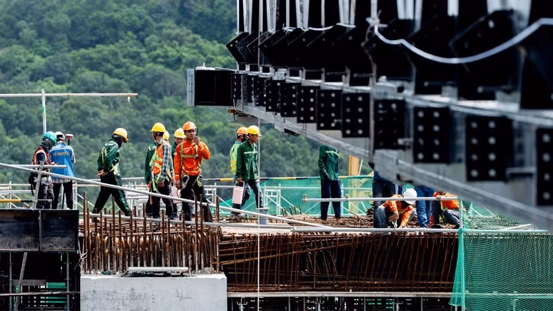 Workers at the construction site of the APEC Summit Centre.