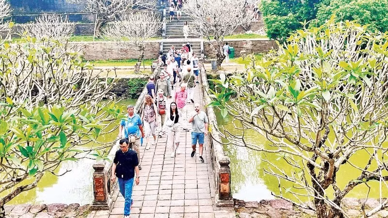 International tourists visit a heritage site in Hue.
