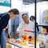 A visitor enjoys sampling Vietnamese soft-dried fruit. (Photo: VNA)