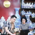 Artisan Tran Trung Hieu (Bat Trang Commune, Gia Lam District, Ha Noi) shares with a fellow artisan the process of listing products on e-commerce platforms. (Photo: HUY HOANG)