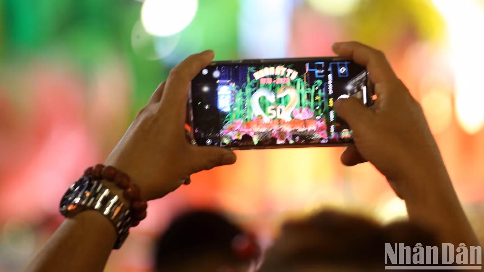 Visitors capture the flower street's memorable moments.