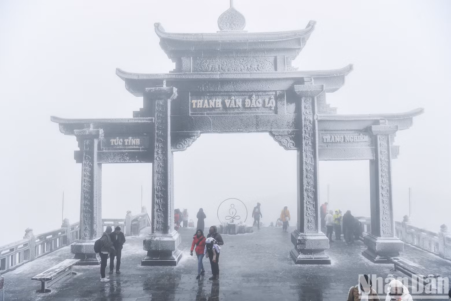 The temple gate is covered in a thin layer of snow.