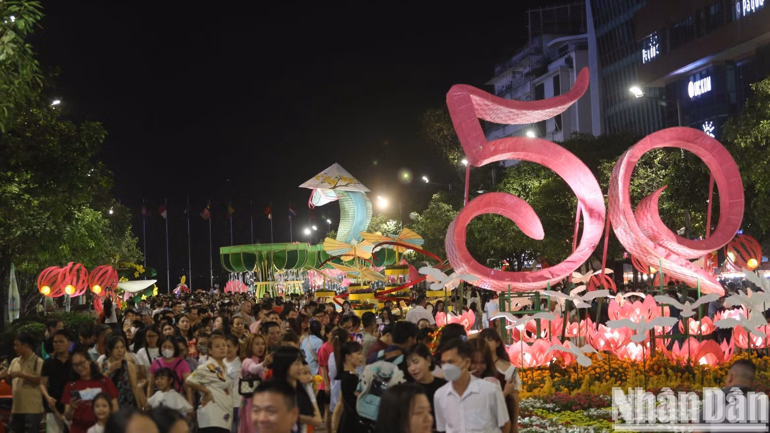 The flower street is packed with visitors.