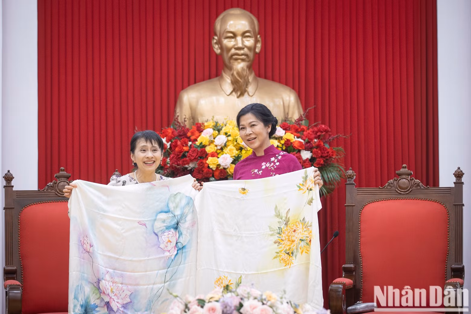 The two ladies pose for a photo.