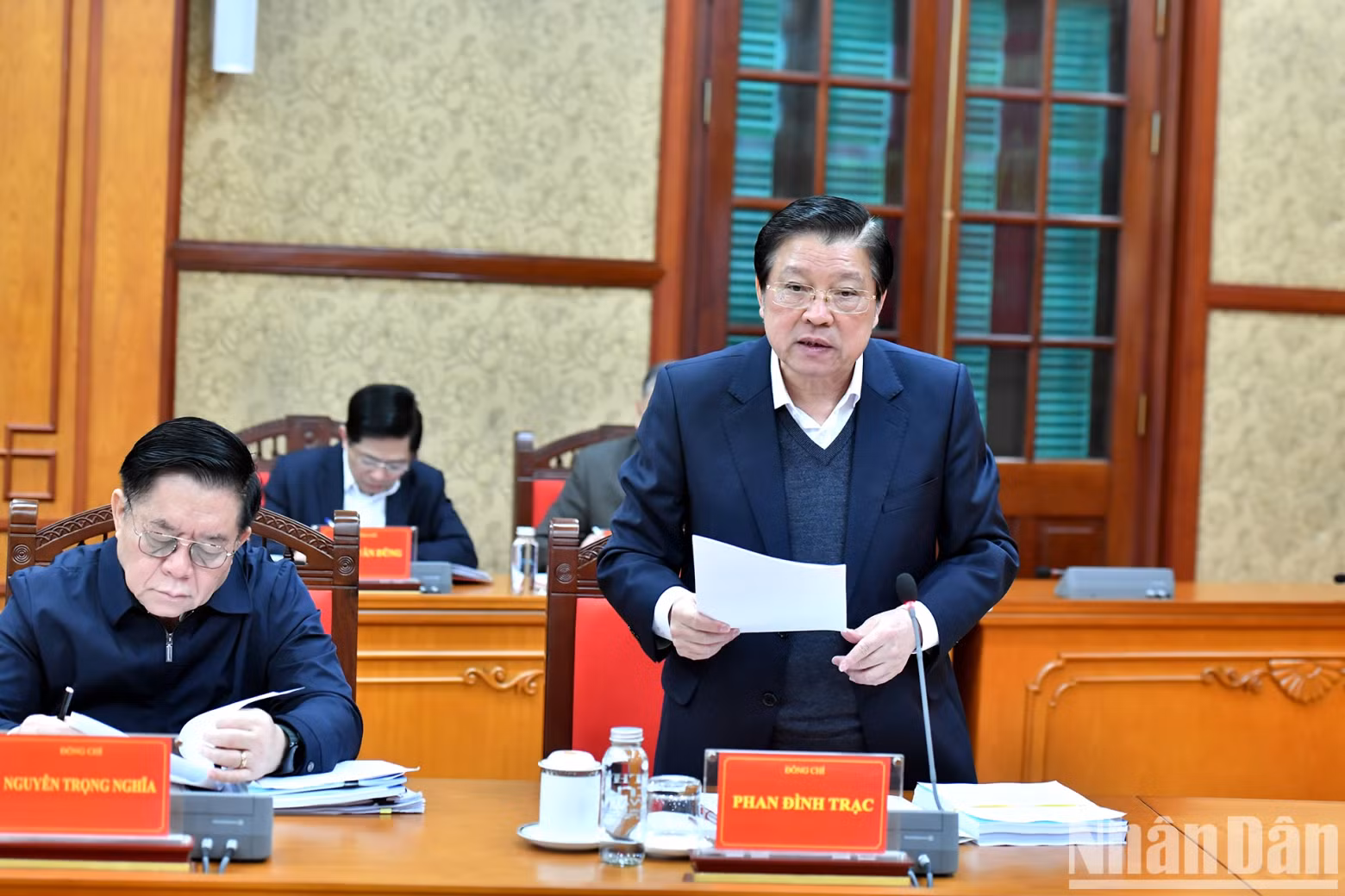 Phan Dinh Trac, Politburo member, Secretary of the Party Central Committee, head of its Commission for Internal Affairs, delivers a report at the meeting