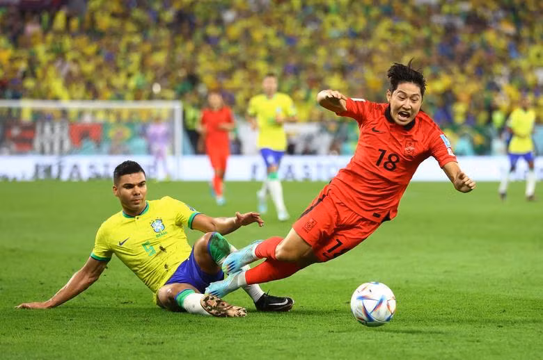 Brazil's Casemiro in action with South Korea's Lee Kang-in. REUTERS/Carl Recine Brazil's Casemiro in action with South Korea's Lee Kang-in. REUTERS/Carl Recine