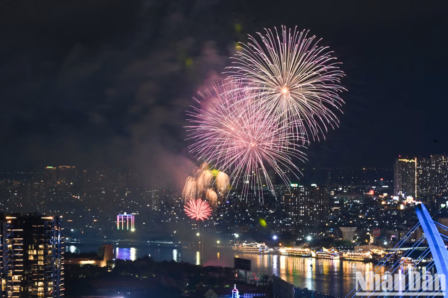 Dazzling fireworks lit up the sky over the Saigon River