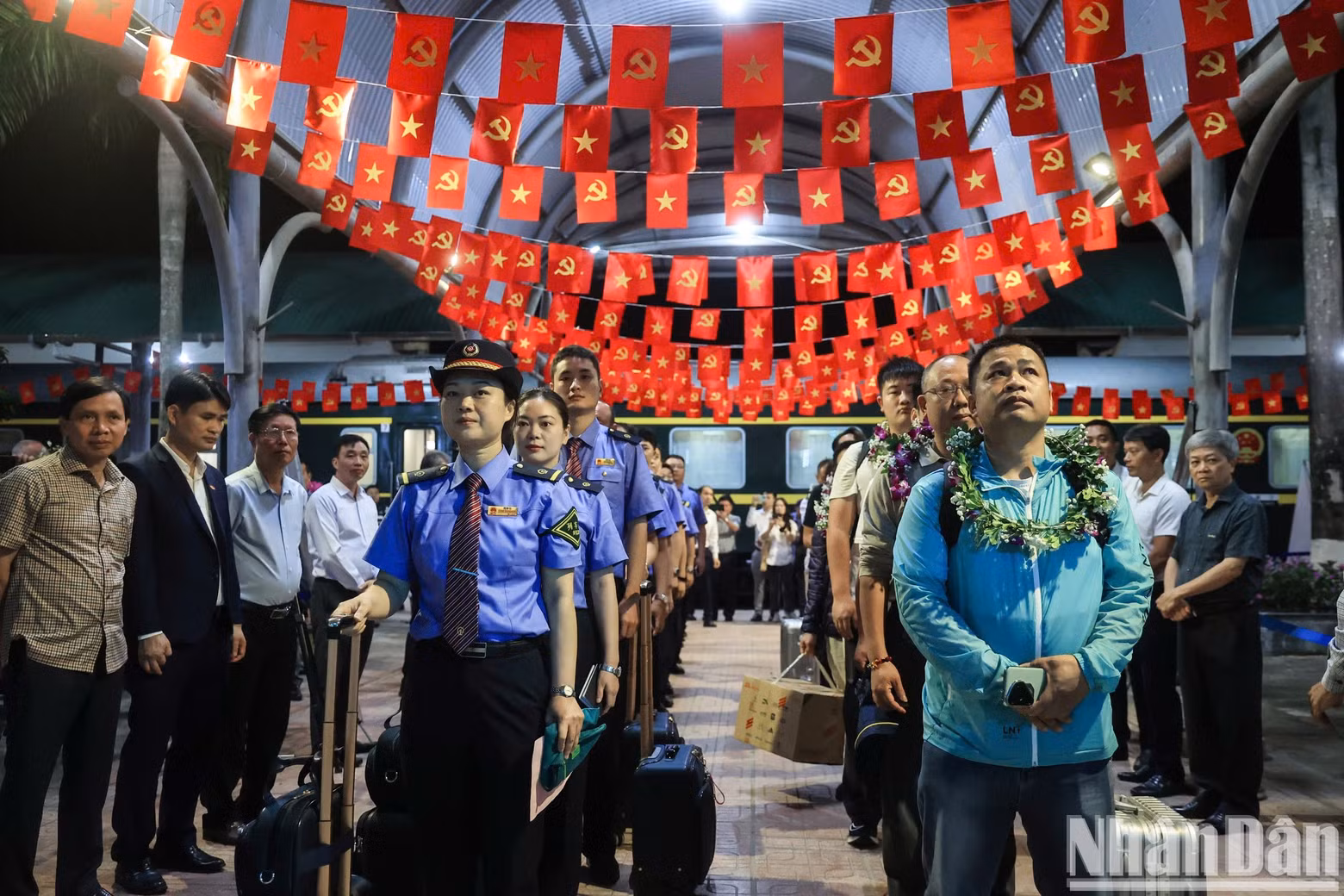 Members of the train crew and passengers waited to complete immigration procedures at Dong Dang station on the evening of May 25.