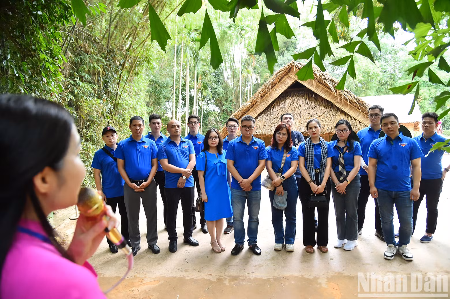 The delegation listening to an introduction to the life of President Ho Chi Minh during his time at the house of Nguyen Sinh Sac, Ho Chi Minh's father.