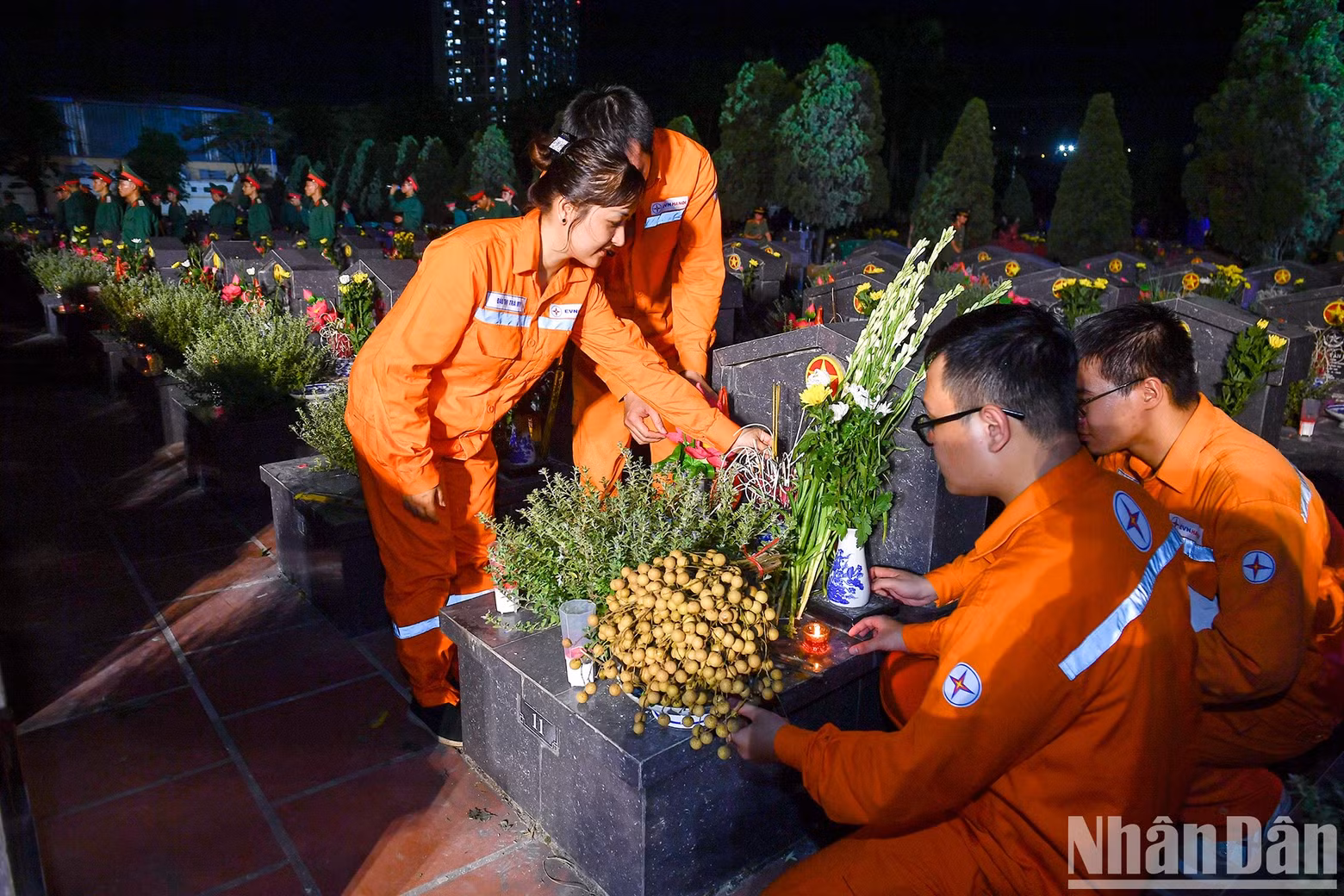 Members of the national power utility EVN offer flowers and incense at the vigil. Members of the national power utility EVN offer flowers and incense at the vigil.