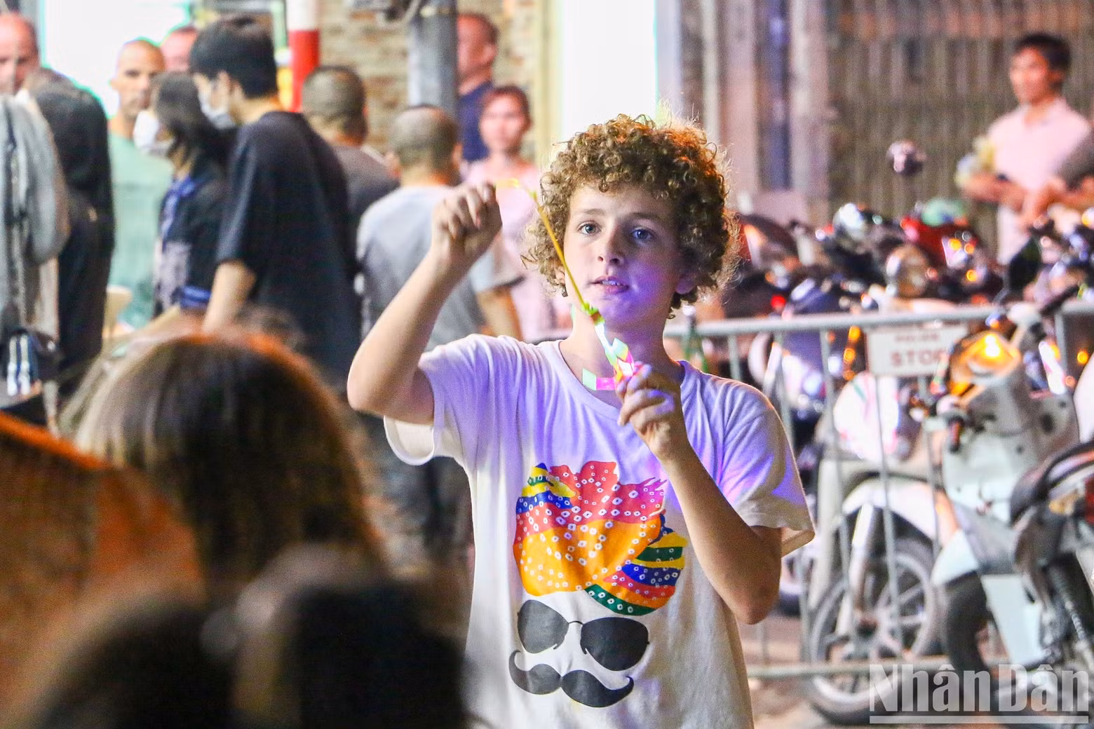 A foreign boy interested in exciting games at the pedestrian space. A foreign boy interested in exciting games at the pedestrian space.