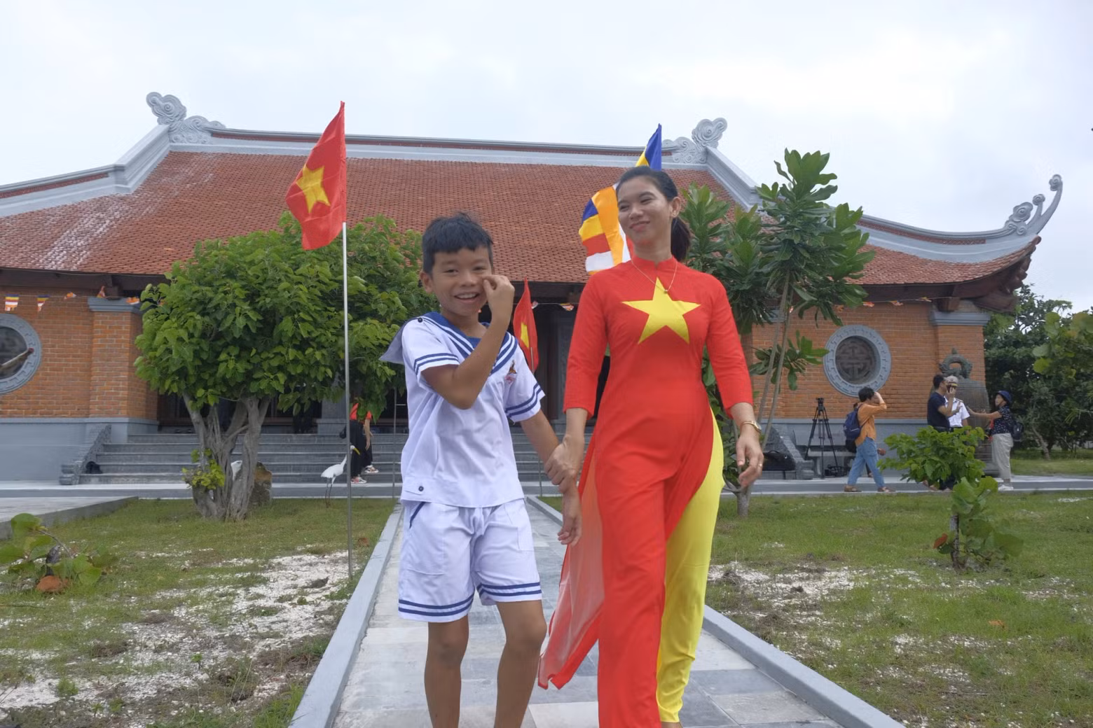 Nguyen Thi Chau Uc and her son visit the local temple to pray for a peaceful and prosperous new year.