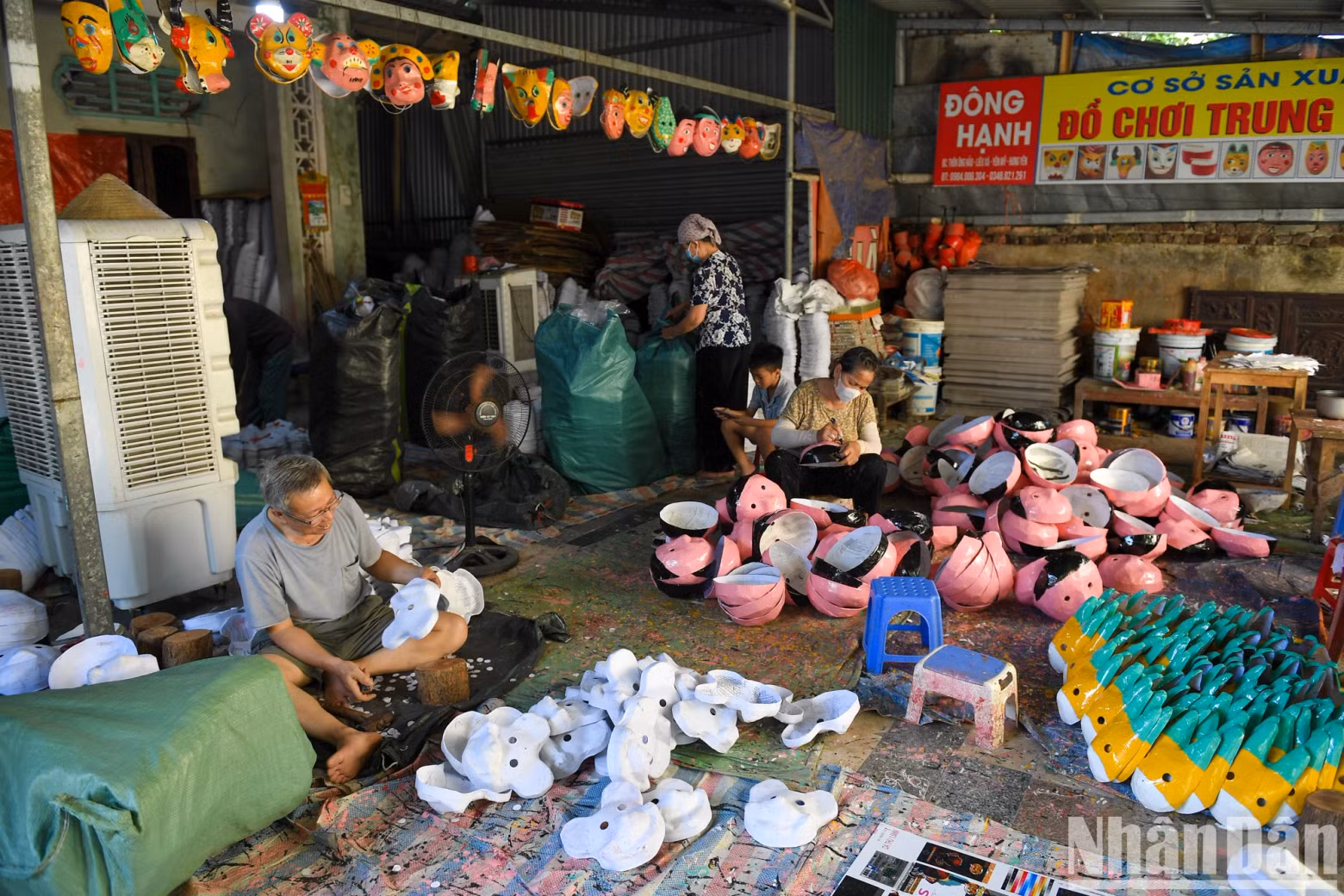 Ong Hao villagers are busy with various stages of producing papier-mâché masks.