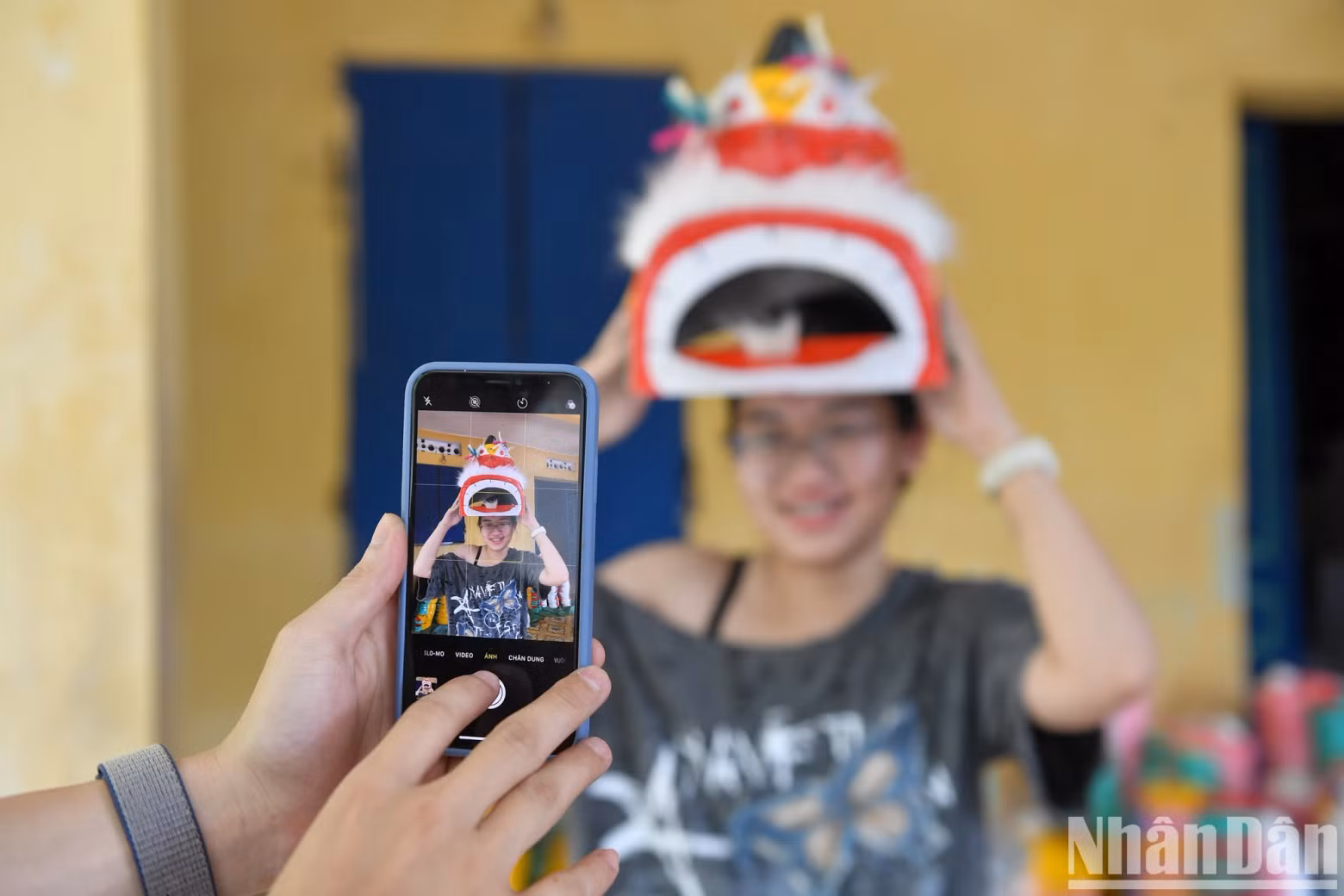 Young people are excited about the traditional papier-mâché masks.