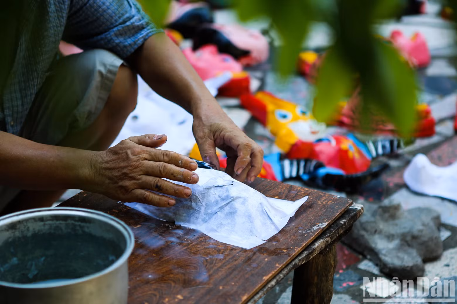 Each mask is made from a different cement mould, where layers of paper are placed and coated with paste.