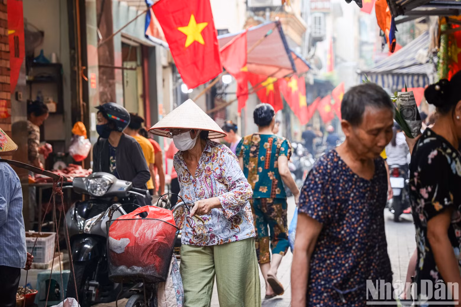 The market inside Yen Thai Street is filled with the cheerful sounds of laughter and trade from the locals.