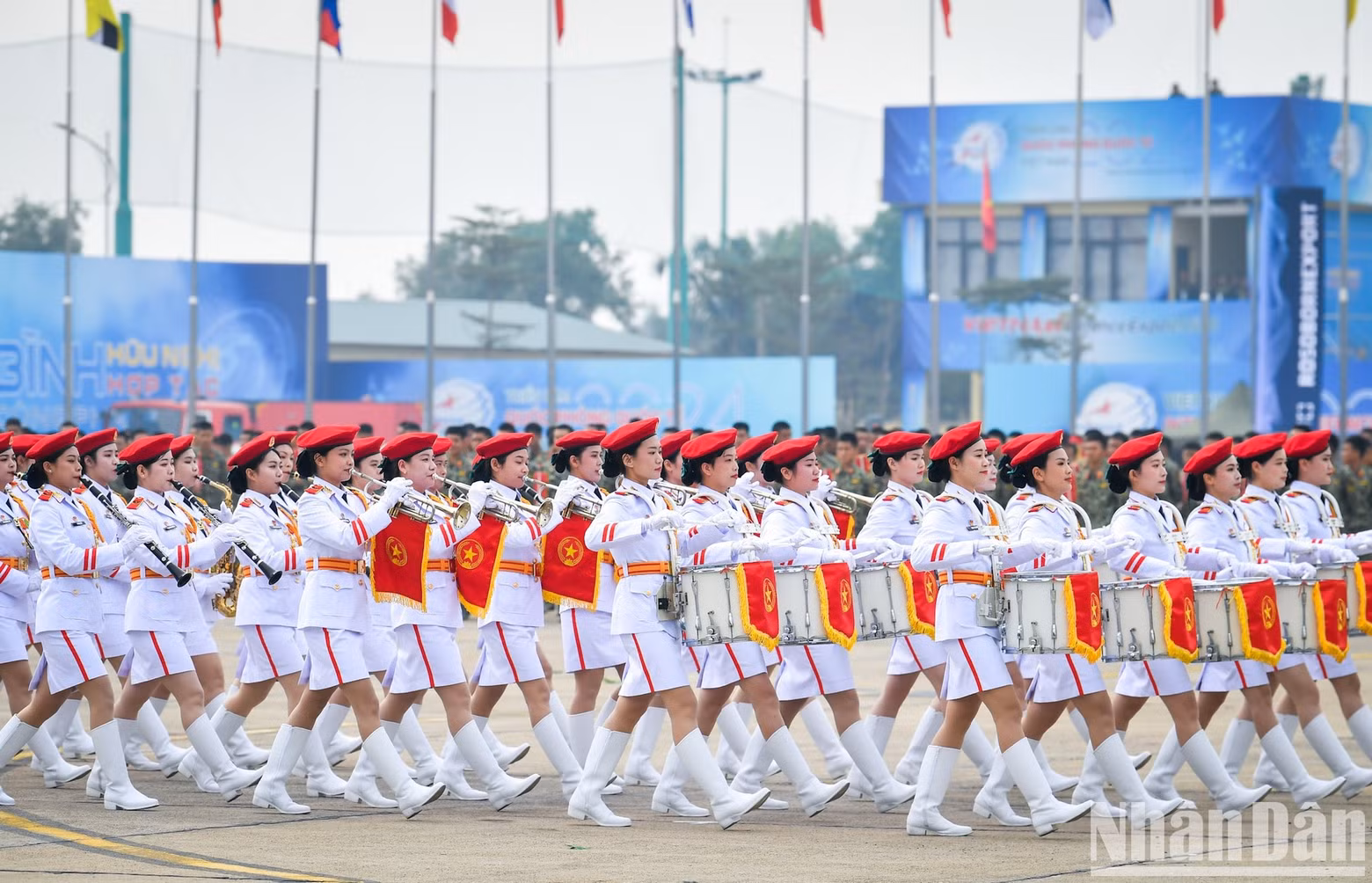 The female military band marches.