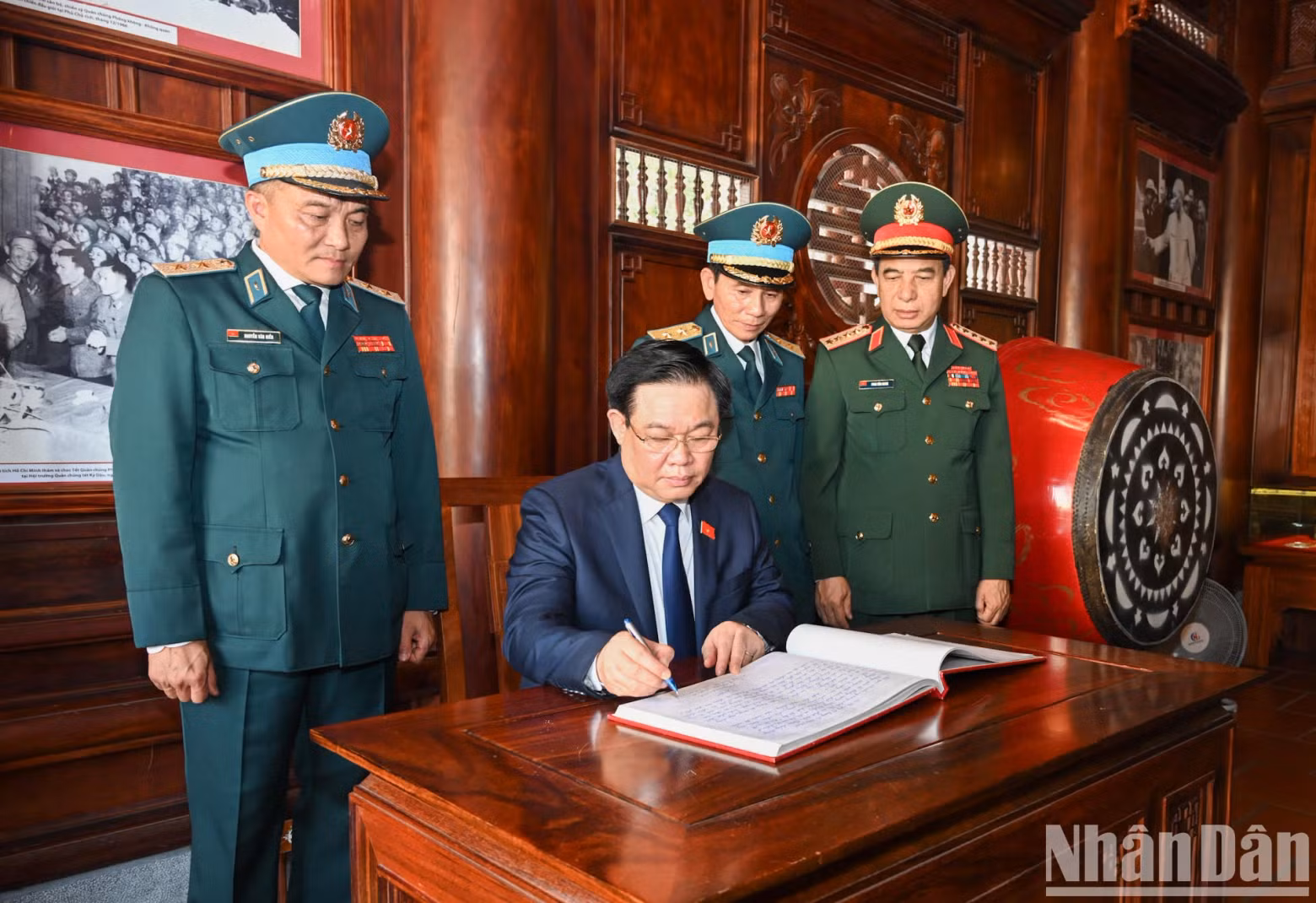 NA Chairman Vuong Dinh Hue writes in the souvenir book of the ADAF.