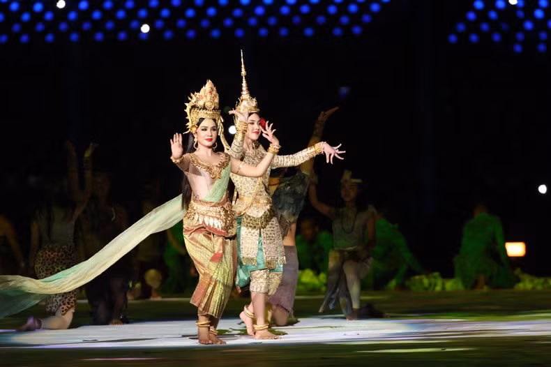 Cambodian women wear traditional costumes and perform an Apsara dance.