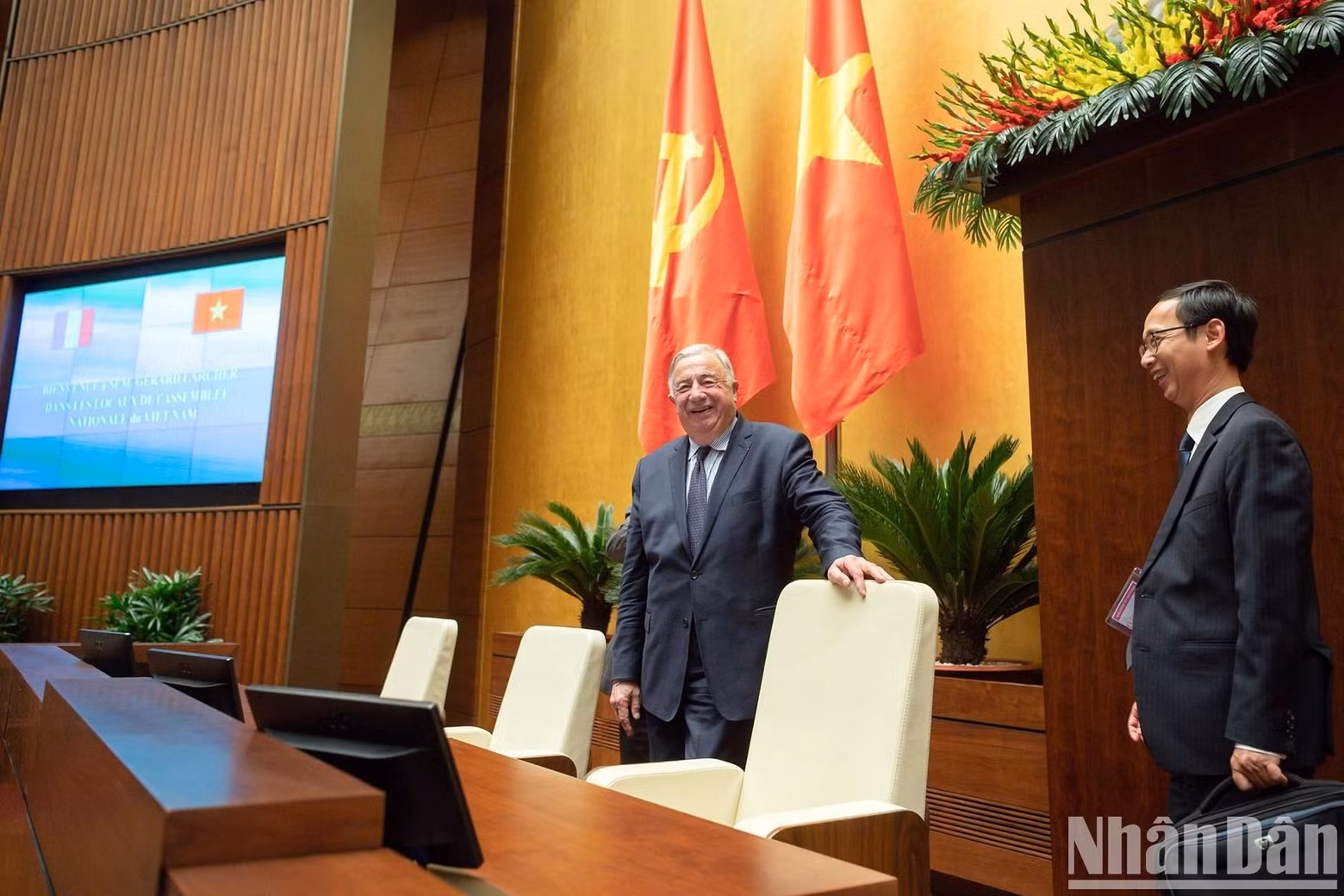President of the French Senate Gérard Larcher listens to the introduction of Dien Hong Hall.