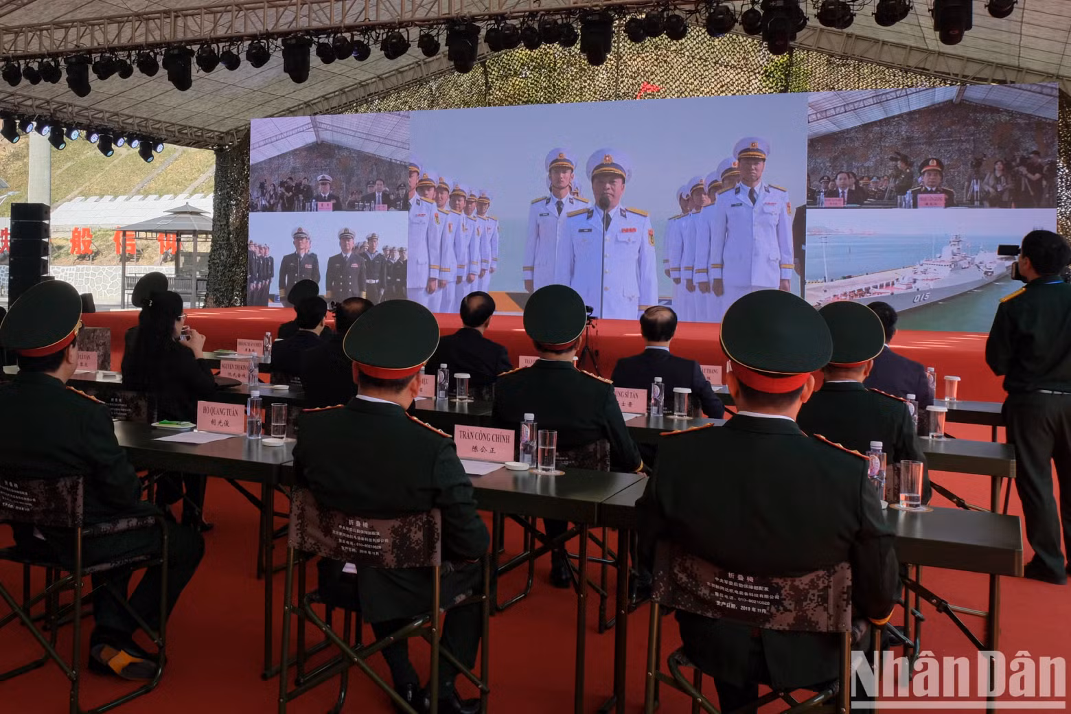 Delegates observe a live report from the naval joint patrol teams of both countries prior to their coordinated patrol.
