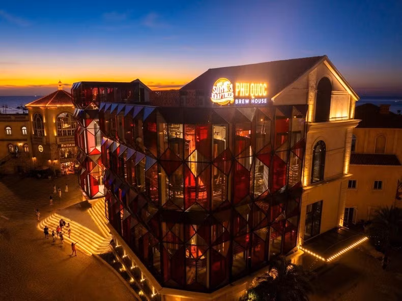 Phu Quoc Brew House shines brightly in the warm hues of the sunset.