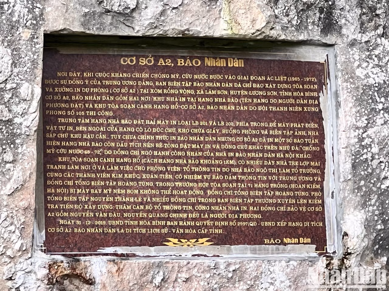 A plaque reading “Base A2, Nhan Dan Newspaper” outside the entrance of the Journalist Cave