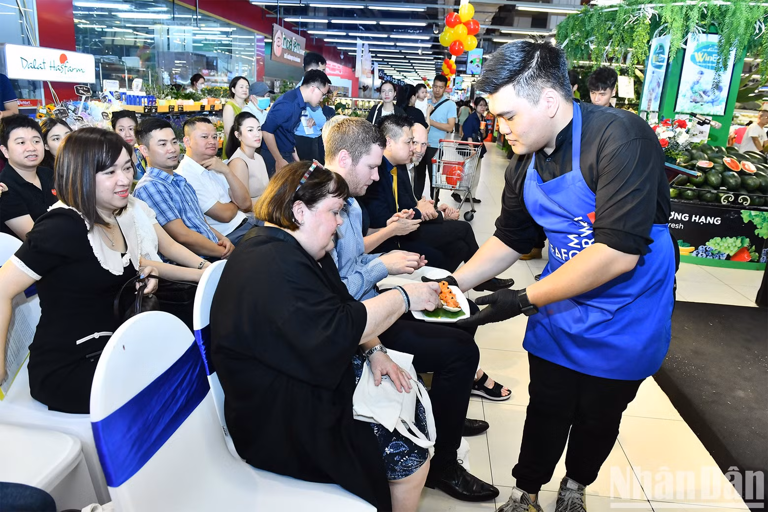 Participants invited to taste Norwegian salmon at the event.