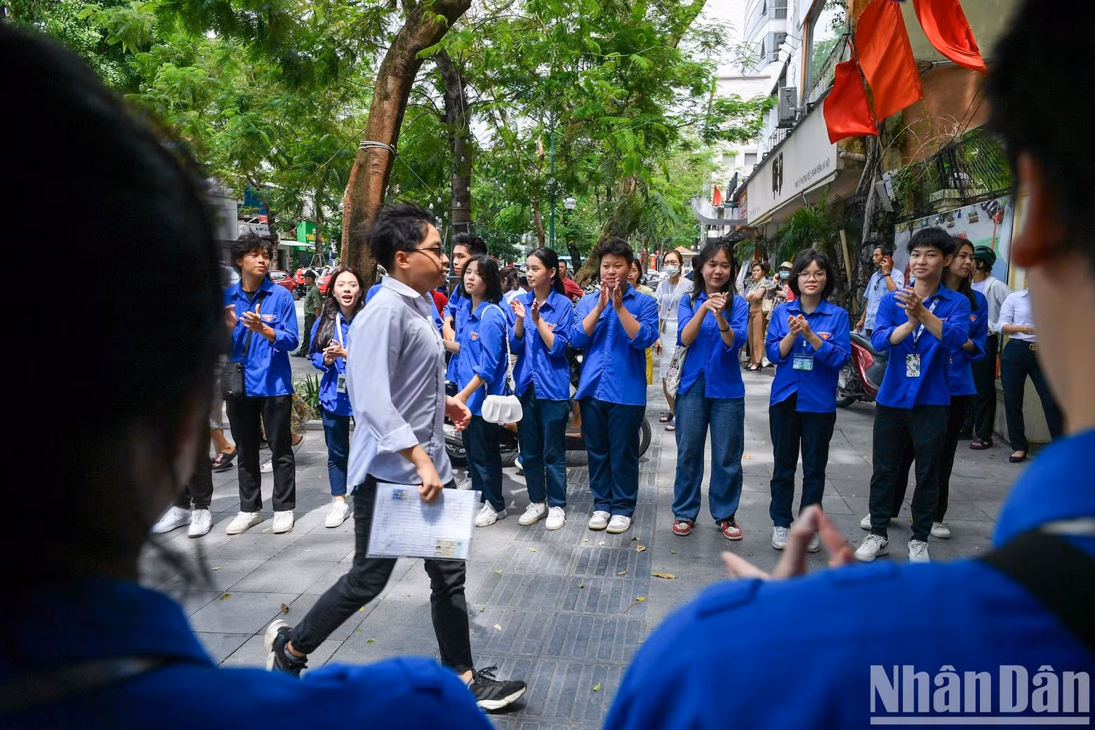 A candidates greeted with applause after finishing the exam.