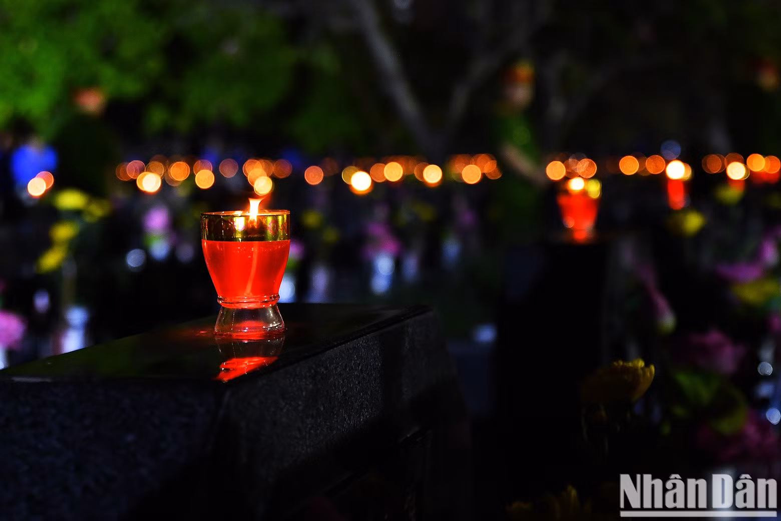 Thousands of candles illuminate the night.
