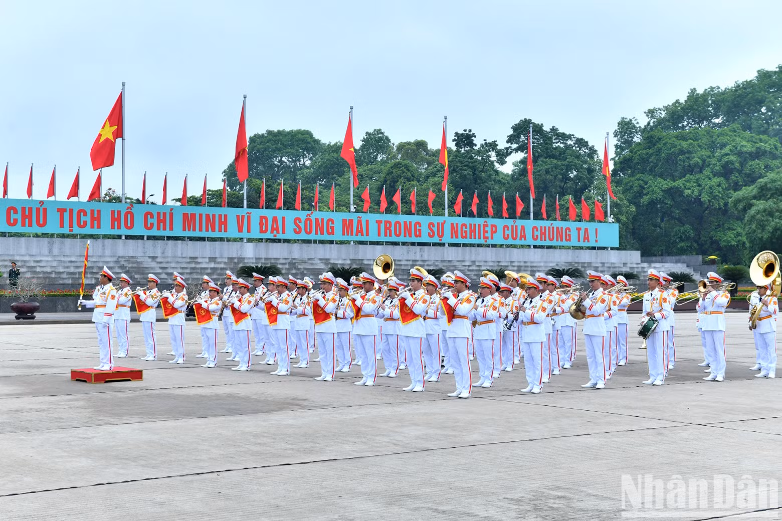 The military band performs ceremonial duties at Ba Dinh Square during the tribute.