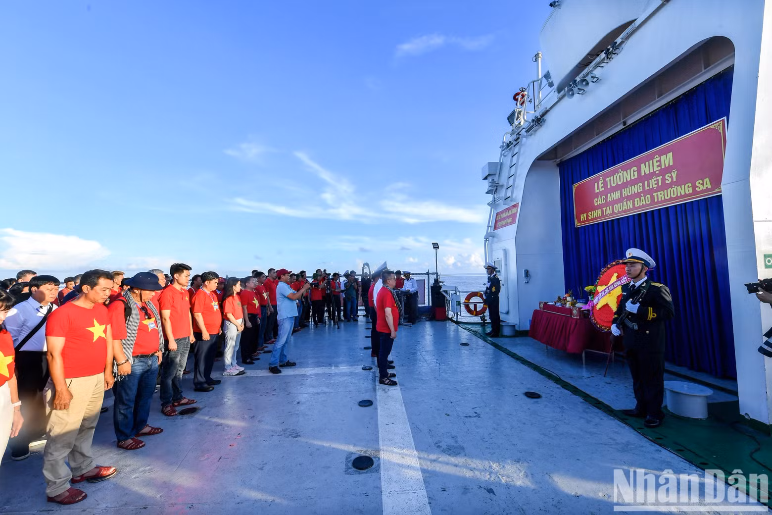 A long, echoing horn sounded from the KN-290 vessel. Members of the delegation stood in reverent silence, with heads bowed in tribute.