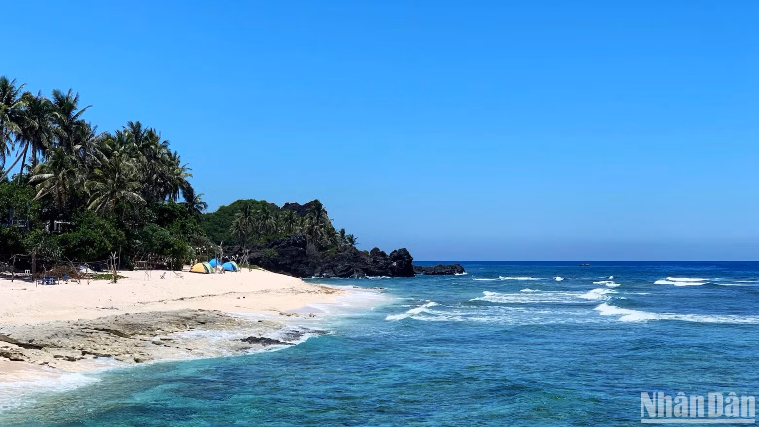 A beachfront area offering camping, dining, and nature-based experiences.