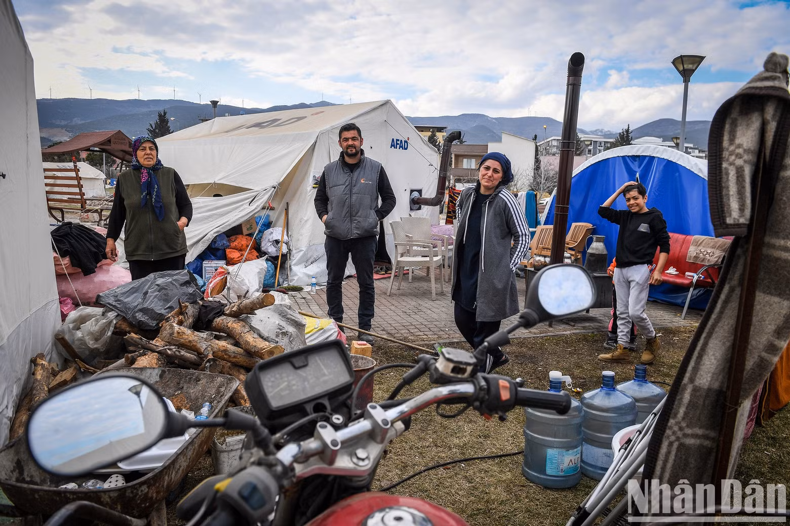 All the remaining precious possessions of this small family were gathered in the open ground behind their tent.