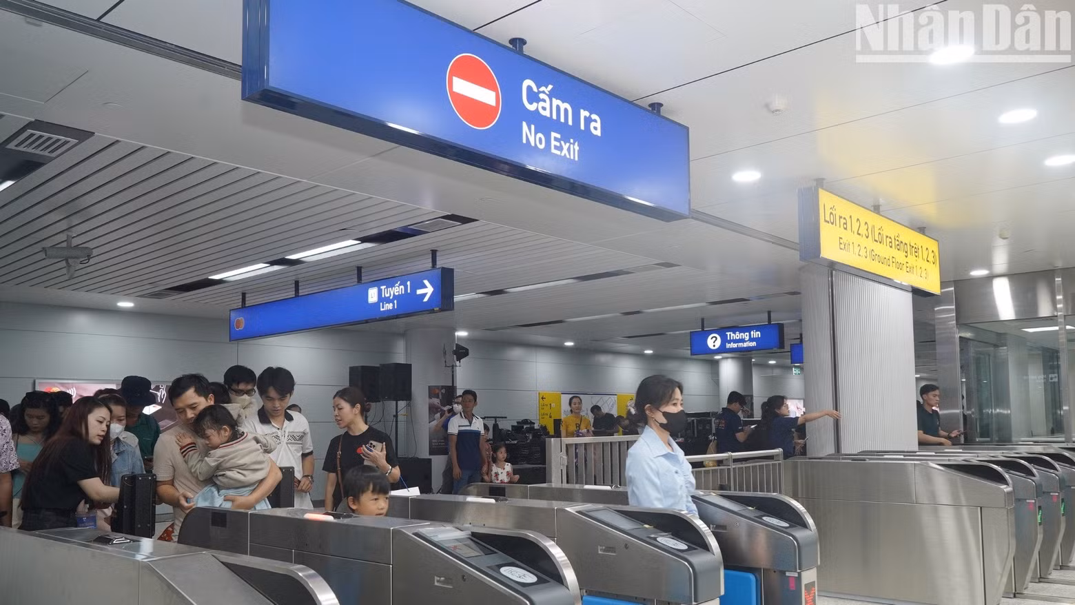 People queue at the ticket gates.