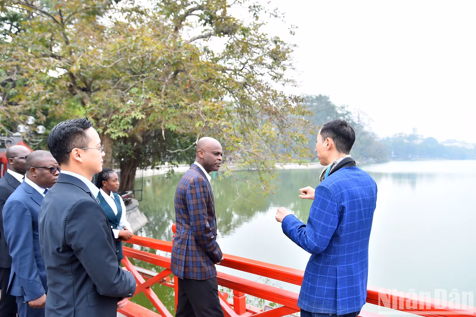 Togolese Foreign Minister Robert Dusse listens to an introduction to the history of Hoan Kiem Lake.