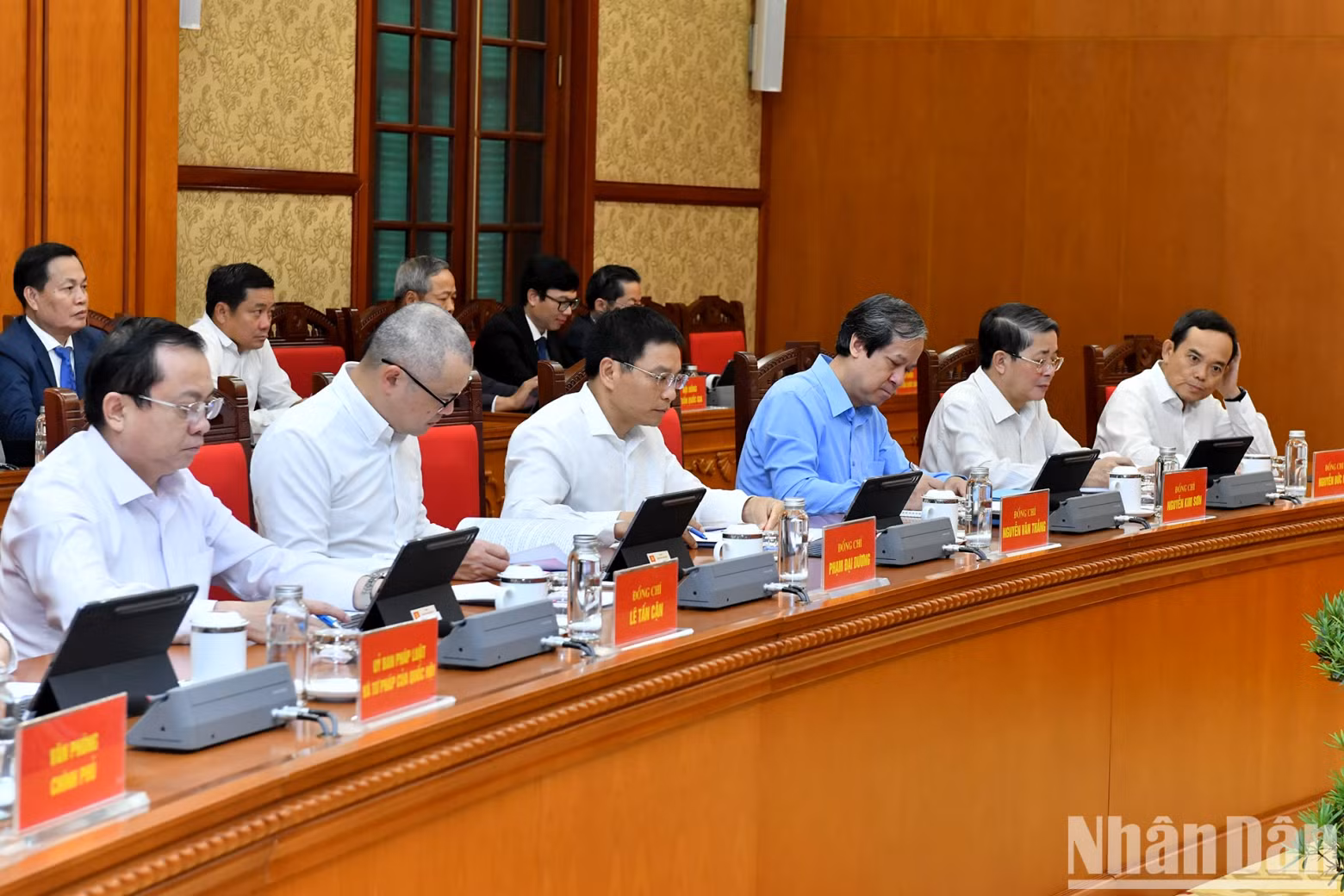 Delegates attend the meeting.