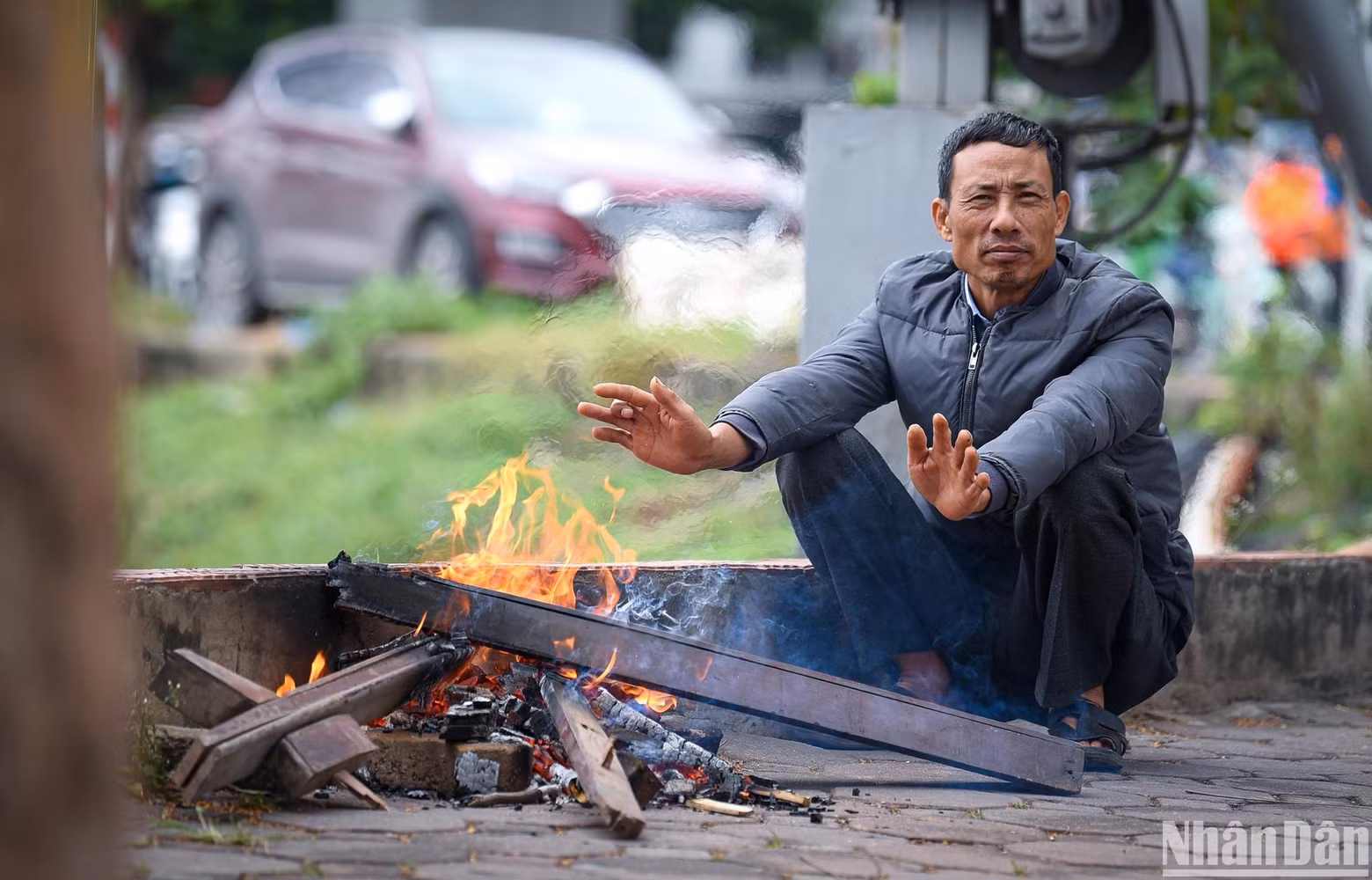 A man-made wood fire to stay warm amid the chilly wind. A man-made wood fire to stay warm amid the chilly wind.