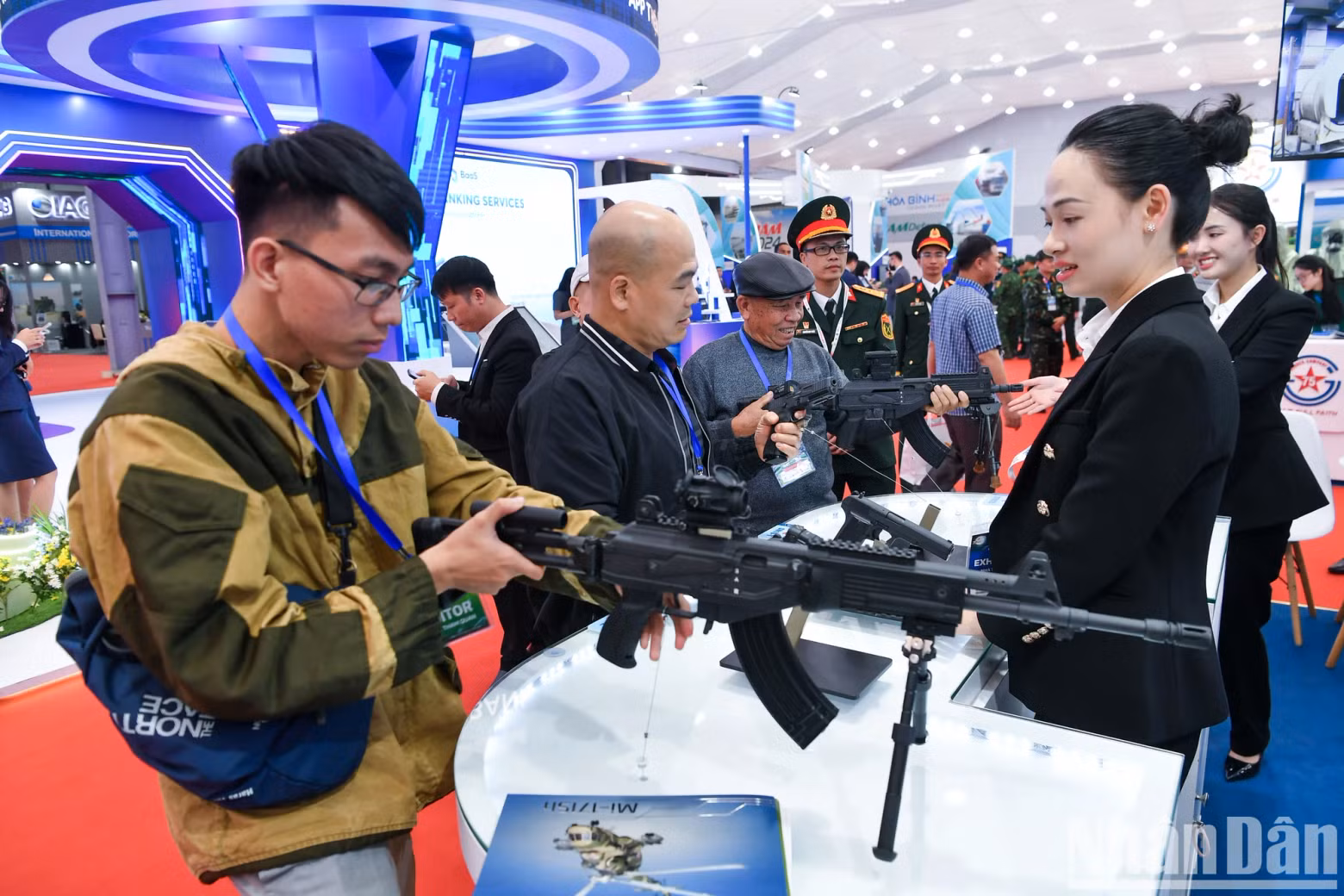 Military equipment attracts special attention from visitors at the beginning of the Exhibition.