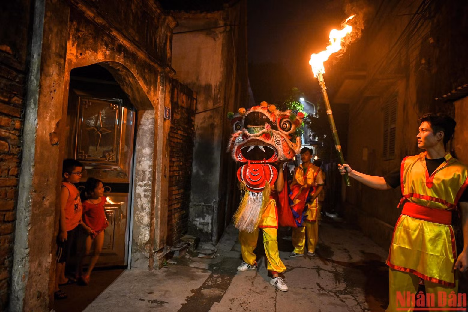 After the lion dance and fire blowing performances end, the group parade and dance around the village.