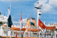 The national flag of Viet Nam flies alongside the flags of other countries at the 2026 Asian Games. (Photo: Viet Nam Sports Delegation)