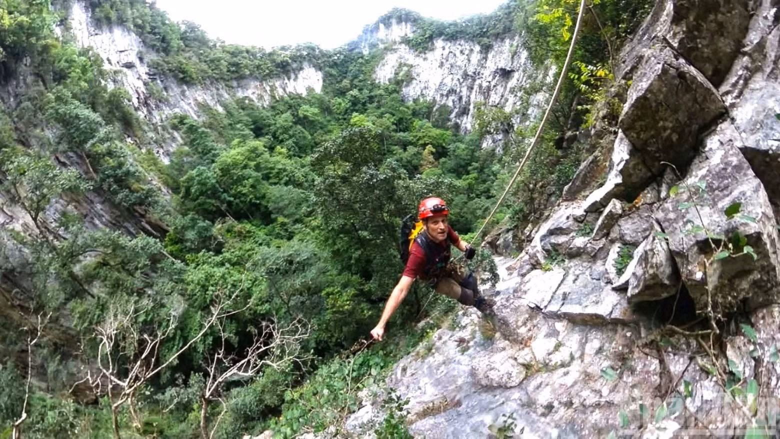 Kevin Ditamore, an expert from the US National Speleological Society, abseils into the sinkhole during the expedition.