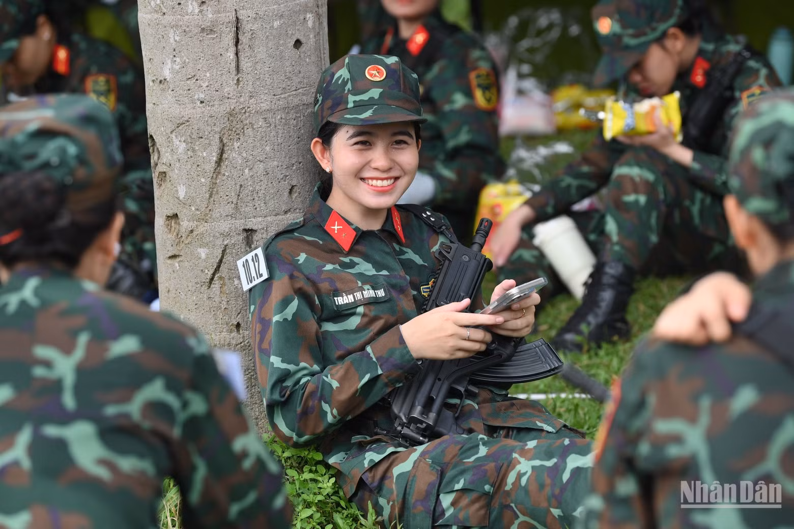 A moment of rest for the female soldiers after training.