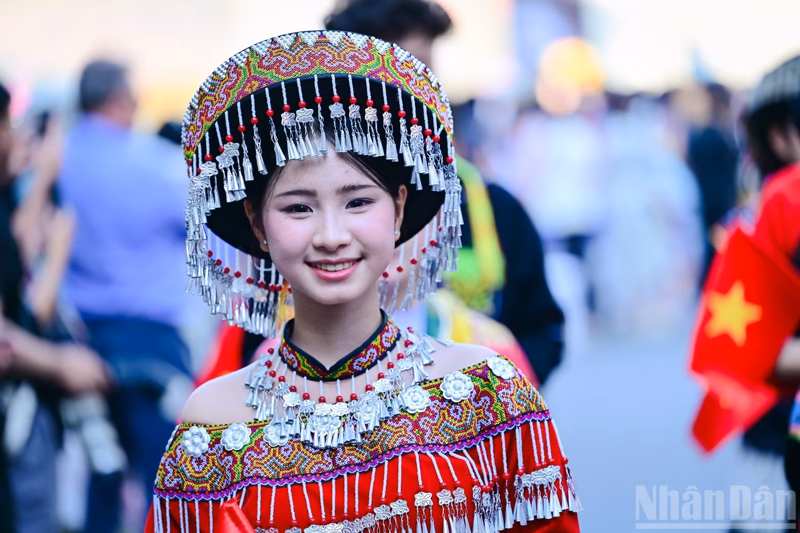 A young participant beam proudly in ethnic costume.