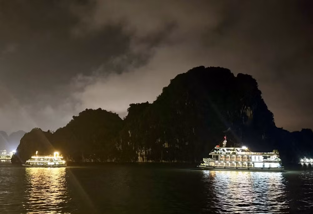 Cruise ships stage a technology-driven light show on Ha Long Bay.