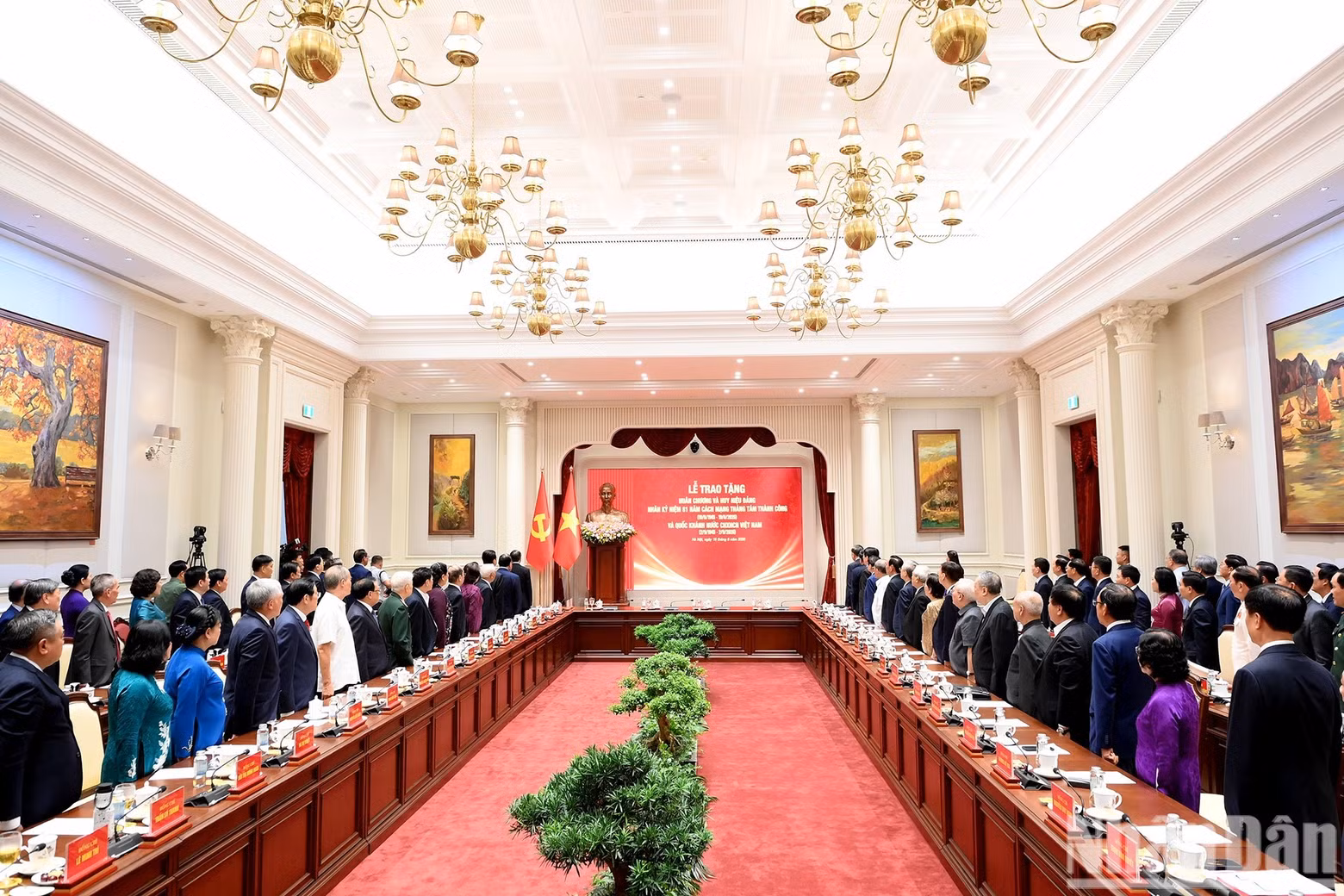 Incumbent and former Party and State leaders and other delegates perform the flag-salute ceremony.